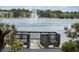 Picturesque pond with central fountain seen from the wooden fishing deck at 9602 Lake Chase Island Way # 9602, Tampa, FL 33626
