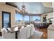 Dining area with water views and an elegant chandelier at 100 Sands Point Dr, Tierra Verde, FL 33715
