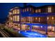 Elegant waterfront home with a stunning pool, inviting patio, and beautifully designed balconies, perfect for relaxation at 100 Sands Point Dr, Tierra Verde, FL 33715