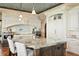 Well-appointed kitchen showcasing custom cabinets and a marble countertop island at 100 Sands Point Dr, Tierra Verde, FL 33715