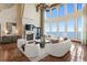 Elegant living room with fireplace and gorgeous view at 100 Sands Point Dr, Tierra Verde, FL 33715