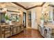 The main bathroom boasts dual vanities, terra cotta flooring, and a walk-in shower at 100 Sands Point Dr, Tierra Verde, FL 33715