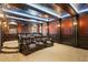 Luxury movie room with leather recliners, ornate ceiling, and tiered seating at 100 Sands Point Dr, Tierra Verde, FL 33715