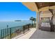 Outdoor patio with a built-in grill and breathtaking water view at 100 Sands Point Dr, Tierra Verde, FL 33715