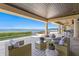 Inviting outdoor patio overlooking ocean with comfortable seating at 100 Sands Point Dr, Tierra Verde, FL 33715