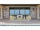 Relaxing patio setting with wicker furniture and unobstructed views of the waterfront at 100 Sands Point Dr, Tierra Verde, FL 33715