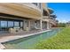 Expansive pool area with comfortable seating and views of the ocean at 100 Sands Point Dr, Tierra Verde, FL 33715
