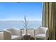 Sitting area with water views, modern decor, and luxury curtains at 100 Sands Point Dr, Tierra Verde, FL 33715