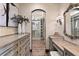 Walk-in closet with custom cabinetry, lighting, and decorative mirror at 100 Sands Point Dr, Tierra Verde, FL 33715