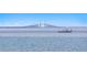Picturesque view of the bay with a boat and the Sunshine Skyway Bridge in the background at 100 Sands Point Dr, Tierra Verde, FL 33715