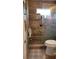 This bathroom includes a glass shower and safety handle at 10040 38Th N Way, Pinellas Park, FL 33782