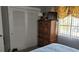 Bedroom features closet, wooden drawers, and window at 10040 38Th N Way, Pinellas Park, FL 33782