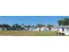 Image of a community pool and tennis courts with palm trees at 10040 38Th N Way, Pinellas Park, FL 33782