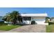 Charming single-story home featuring a brick driveway, attached garage, and well-maintained landscaping at 10040 38Th N Way, Pinellas Park, FL 33782