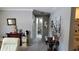 Hallway with carpet, neutral paint, and views into the bathroom at 10040 38Th N Way, Pinellas Park, FL 33782