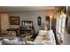 Comfortable living room with neutral colors, cozy seating, and natural light through the window at 10040 38Th N Way, Pinellas Park, FL 33782