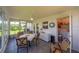 Bright sun room with views of the yard, tiled floors and ceiling fan at 10040 38Th N Way, Pinellas Park, FL 33782