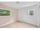 Bright bedroom featuring wood laminate flooring and natural lighting through the windows at 10208 N 23Rd St, Tampa, FL 33612