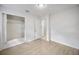 Bedroom featuring wood laminate flooring, closet and neutral paint, perfect for relaxation at 10208 N 23Rd St, Tampa, FL 33612