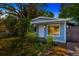 Charming single-story home with light blue exterior and well-maintained front yard landscaping at 10208 N 23Rd St, Tampa, FL 33612