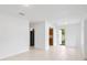 Bright, spacious living room with neutral walls and views of the kitchen at 10208 N 23Rd St, Tampa, FL 33612