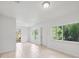 Large bright living room featuring tiled floors and lots of natural light at 10208 N 23Rd St, Tampa, FL 33612