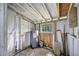 Interior view of the shed featuring a water heater, pegboard, and some tools at 10208 N 23Rd St, Tampa, FL 33612