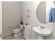 Clean half bath featuring modern fixtures and neutral decor at 10313 Wine Press Ave, Riverview, FL 33578