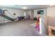 Large bonus room with carpet flooring, TV, games and plenty of space for recreation at 10313 Wine Press Ave, Riverview, FL 33578