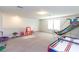 Spacious bonus room with carpet flooring perfect for entertainment, play, or as a lounge at 10313 Wine Press Ave, Riverview, FL 33578