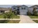 Charming two-story home with a well-maintained lawn and a two-car garage at 10313 Wine Press Ave, Riverview, FL 33578