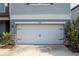 Close-up of a clean, well-maintained two-car garage door at 10313 Wine Press Ave, Riverview, FL 33578