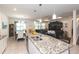 Spacious kitchen flows into the dining and living areas, featuring granite countertops and stainless steel appliances at 10313 Wine Press Ave, Riverview, FL 33578