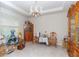 Bright living room with tiled floors, chandelier, and many decorations at 10313 Wine Press Ave, Riverview, FL 33578