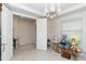 Bright room with open doorway and neutral tile flooring and decorations at 10313 Wine Press Ave, Riverview, FL 33578