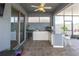 Outdoor kitchen with granite countertops, grill, mini fridge and plenty of counter space at 10313 Wine Press Ave, Riverview, FL 33578