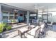 Spacious covered patio with multiple seating areas, an outdoor kitchen, and ceiling fans at 10313 Wine Press Ave, Riverview, FL 33578