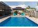 Inviting pool featuring a gazebo with Adirondack chairs, perfect for relaxation and entertainment at 10313 Wine Press Ave, Riverview, FL 33578