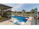 Beautiful pool area with a sun shelf, gazebo, and well-maintained landscaping at 10313 Wine Press Ave, Riverview, FL 33578