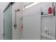 Enclosed shower stall is equipped with built-in shelves and a rain shower head at 10313 Wine Press Ave, Riverview, FL 33578