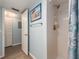 Bathroom featuring white tiled shower and coastal themed decor at 105 Woodlake Wynde, Oldsmar, FL 34677
