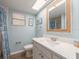 Bright bathroom featuring a large mirror, updated vanity, and a beachy vibe at 105 Woodlake Wynde, Oldsmar, FL 34677