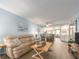 Open-concept living area with a combined living room, dining space, and a view into the kitchen at 105 Woodlake Wynde, Oldsmar, FL 34677