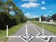 Enjoy the scenic neighborhood walking path with lush greenery and well-maintained surroundings at 105 Woodlake Wynde, Oldsmar, FL 34677