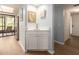 Convenient wet bar with a sink and cabinet, perfect for entertaining guests and quick access to the lanai at 105 Woodlake Wynde, Oldsmar, FL 34677