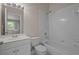 Traditional bathroom with white tiled shower and bathtub at 1118 Kennewick Ct, Wesley Chapel, FL 33543