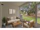 Comfortable patio space with a sofa and outdoor view, perfect for relaxing at 1118 Kennewick Ct, Wesley Chapel, FL 33543