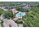 Aerial view of the apartment complex highlighting the community pool and lush landscaping at 11901 4Th N St # 8207, St Petersburg, FL 33716