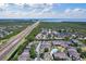 Excellent aerial view showcases beautiful complex, surrounding landscape, and distant ocean views at 11901 4Th N St # 8207, St Petersburg, FL 33716