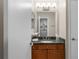 Bathroom features a granite countertop with a mirror and cabinet space at 11901 4Th N St # 8207, St Petersburg, FL 33716